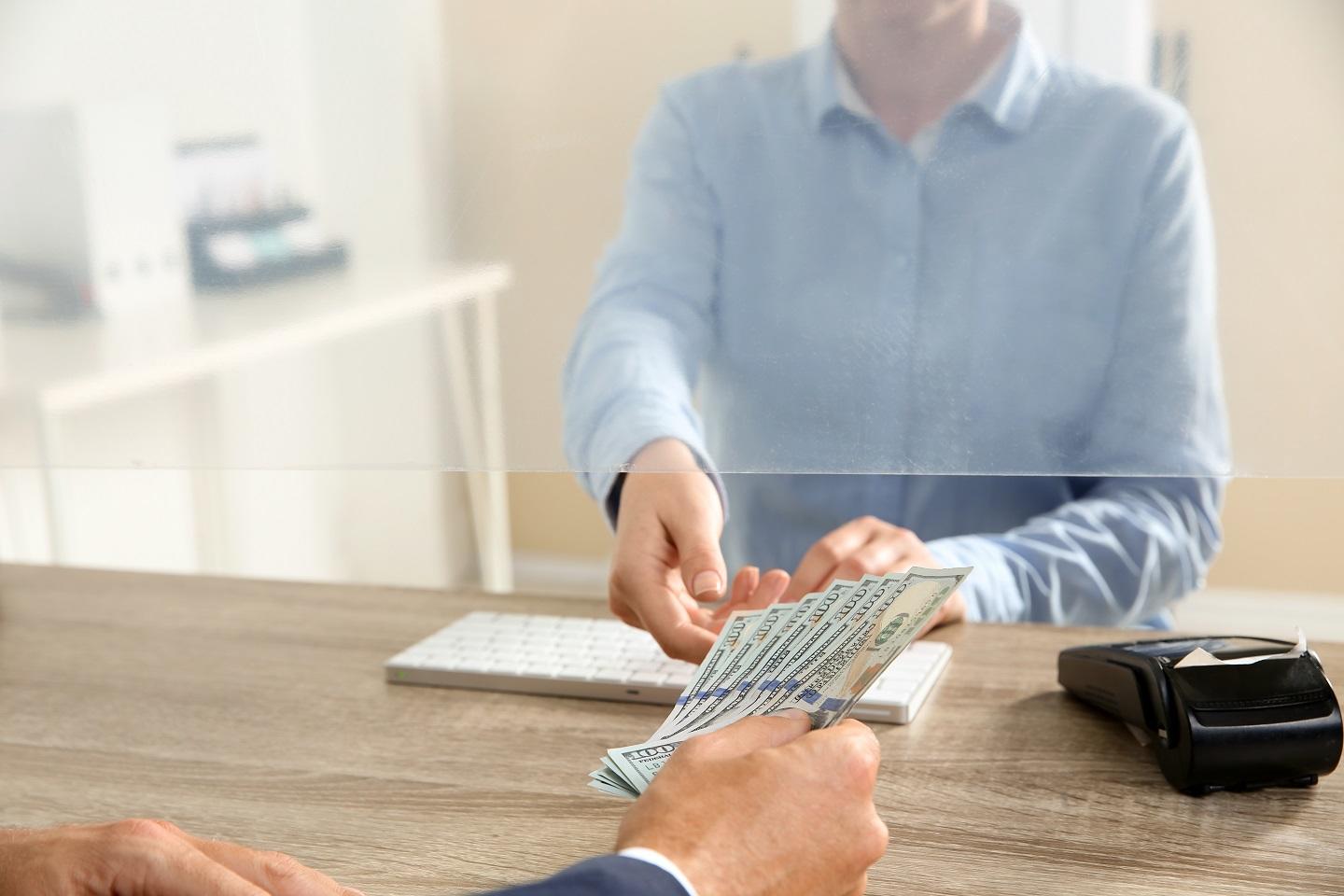 Credit Union teller and customer